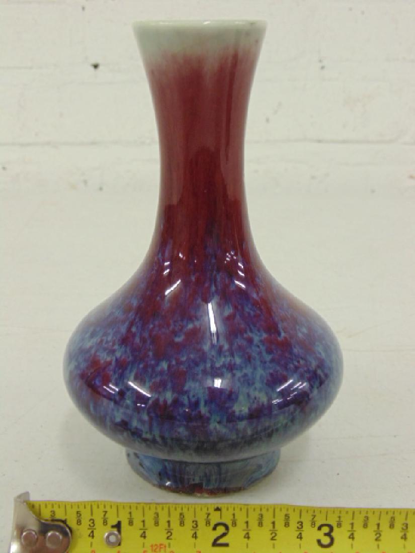 Chinese Red to blue glazed Sang de boeuf vase: Chinese flambe Ox Blood Red to blue glazed Sang de boeuf vase, height is 5 1/8", in good condition. . Please refer to images for general condition issues, all items sold in "as is" condition, all sale