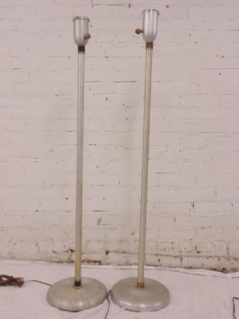 2 Russel Wright spun aluminum floor lamps: 2 Russel Wright spun aluminum floor lamps, brass collar, wood knob, no shades, lamps need restoration, sold as found, height is 51.25 & 49.75"