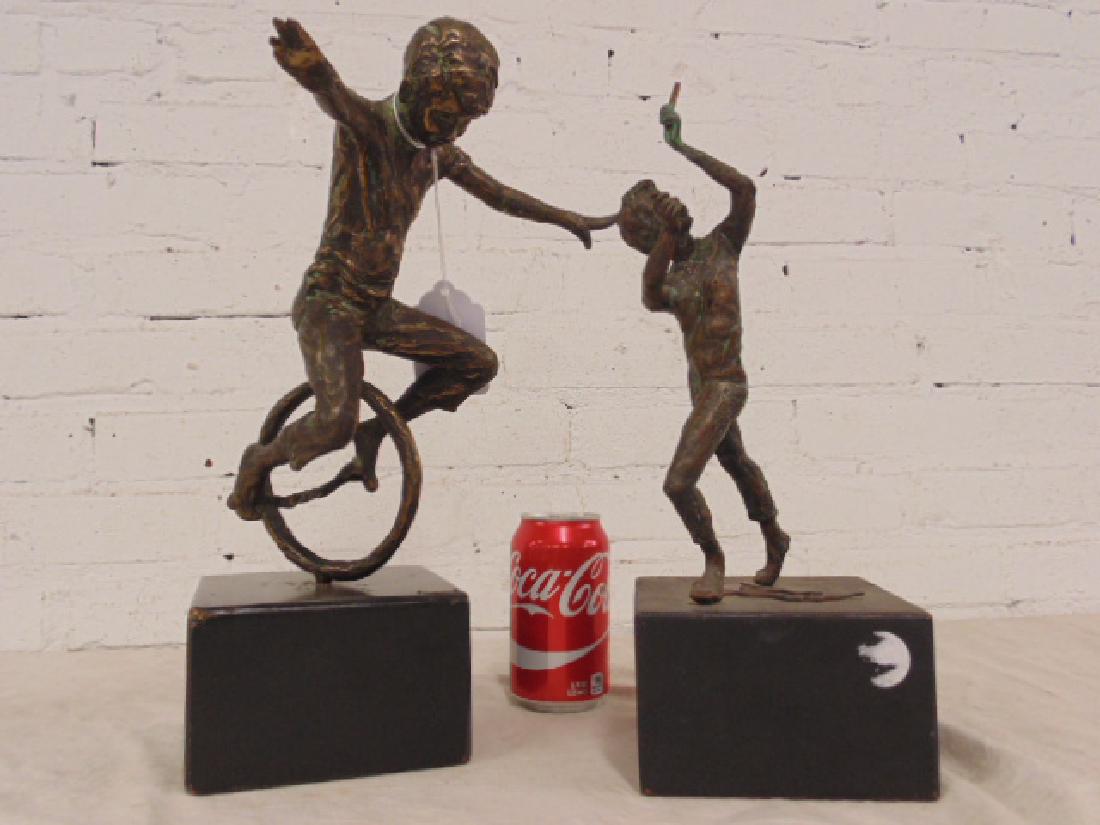 Curtis Jere bronze & bronze boy: Curtis Jere bronze, figure on unicycle & bronze boy, both on wooden bases Please refer to images for general condition issues, all items are sold in as is, as found condition, some items might have re