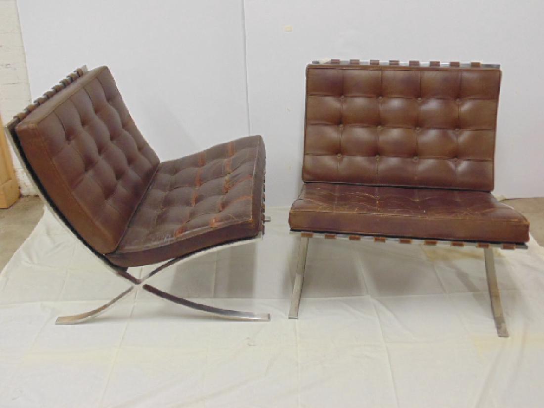 Pair of Mies van der Rohe Barcelona chairs by Knoll: Pair of Mies van der Rohe Barcelona chairs by Knoll, brown leather, steel base, leather worn, chairs are 29.25 wide, 30" deep & 29.5" tall. All items sold as is, all sales final, contact us if you nee