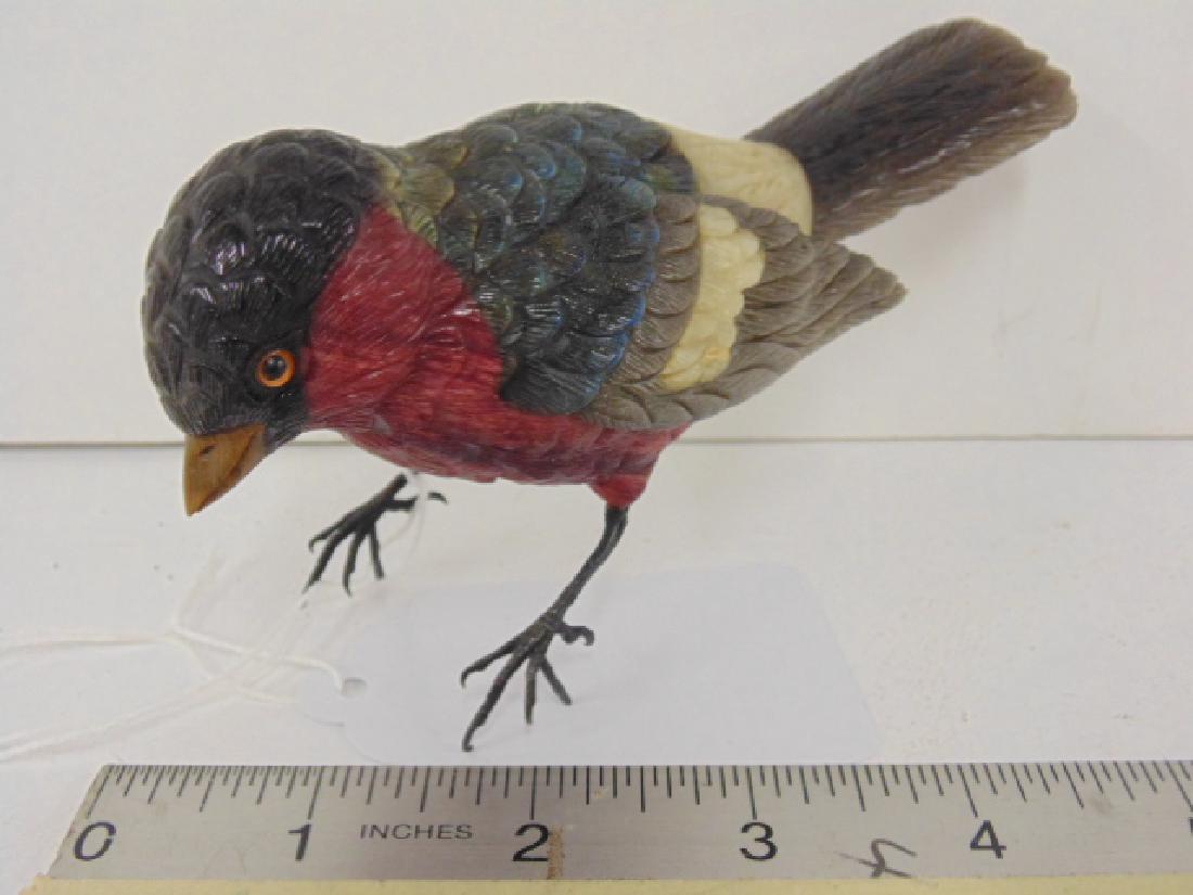 Hard stone carved bird, Russian?: Hard stone carved bird, Faberge quality, one wing broken and missing, red, white & iridescent stone body, silver legs, hallmarked 800? plus a small ill. mark , tiger eye beak, 5.5" long