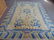Chinese carpet, ivory field with blue striped border