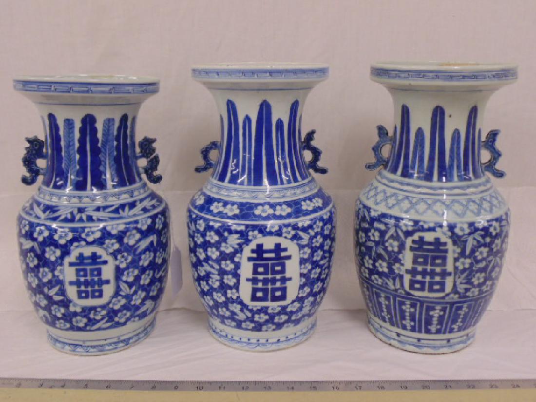 3 Chinese porcelain Shuangxi vases: 3 Chinese porcelain blue & white "double Happiness" Shuangxi symbol, vases, 2 vases are 14", one is 13,25" tall, one of the taller vases has minor chip inside rim as well as a small piece of handle mi