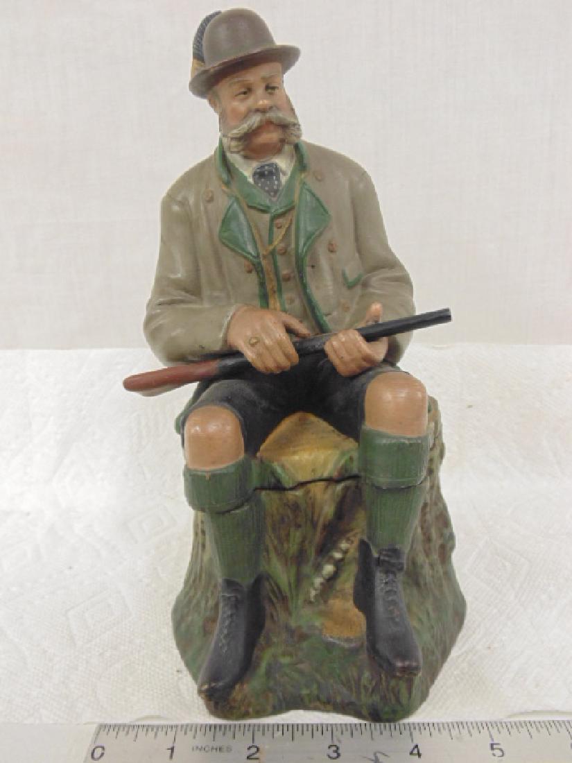 Bernard Bloch Hunter Tobacco Jar, Hunter holding rifle: Bernard Bloch Hunter Tobacco Jar, Humidor, terra cotta, Hunter holding rifle, seated on tree trunk, signed "B.B", height is 9.5", in good condition