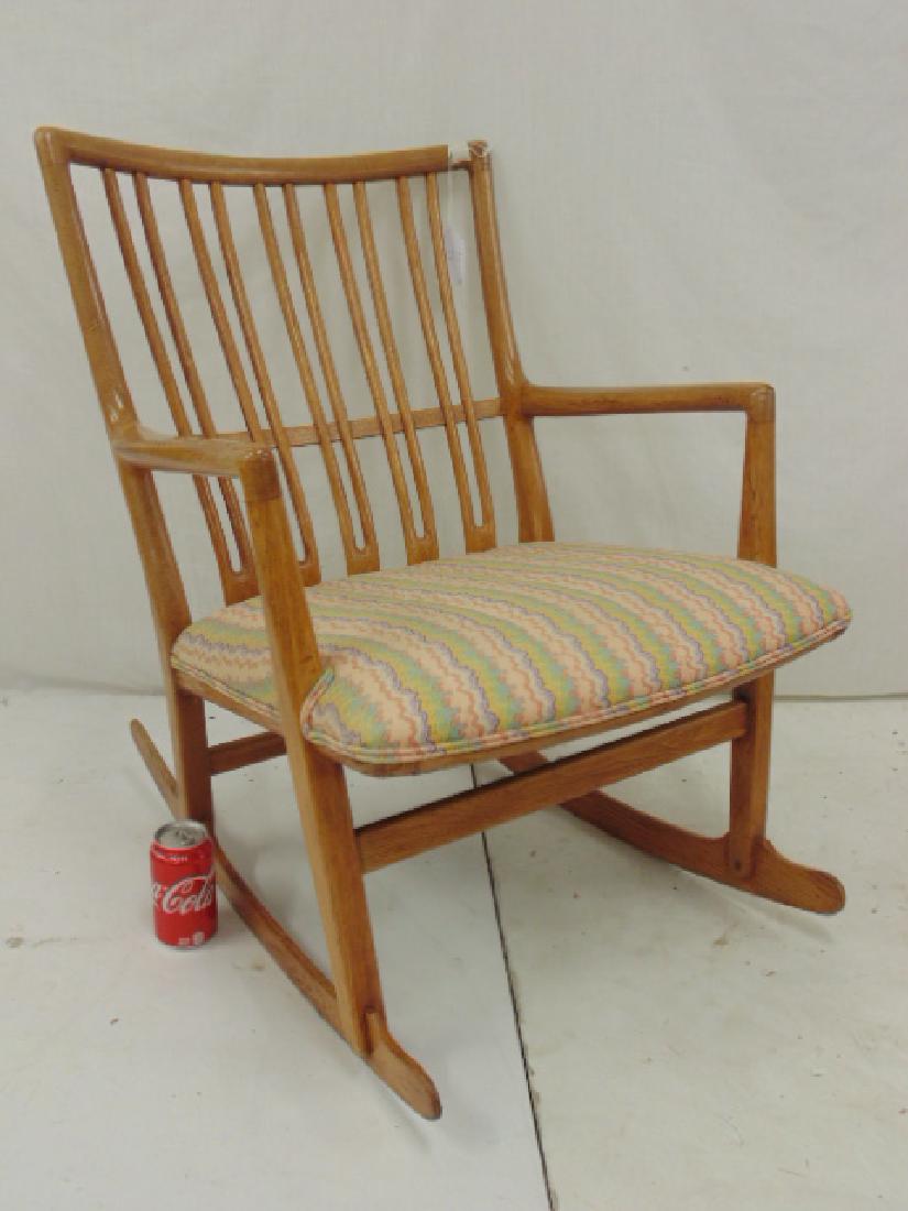 Rare Hans Wegner ML-33 rocking chair,: Rare Hans Wegner ML-33 rocking chair, in oak, chair is 24.5" wide, 19" deep (seat) & 30.5" tall, replaced upholstered seat, repair to one leg, otherwise in good condition. All items sold as is, as fou
