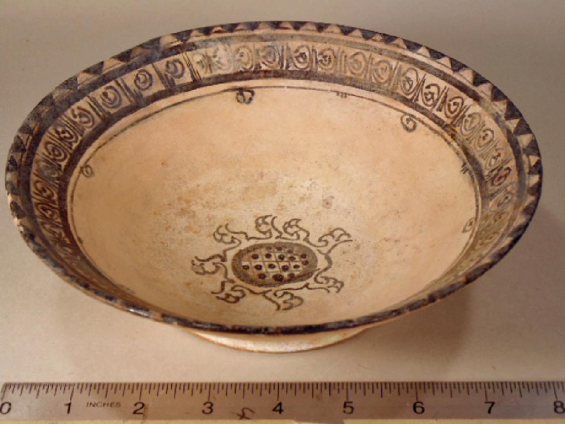 Nishapur Islamic Persian bowl, slip painted, yellow: Nishapur Islamic Persian bowl, slip painted, yellow staining black ware, decorated with intricate center pattern & rim border, in restored condition, diameter is 8.25" height is 2 3/8", Bidancient. Di
