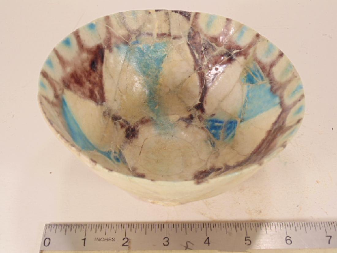 Tunisian Islamic Ceramic Bowl, 1000-1100 AD, painted: Tunisian Islamic Ceramic Bowl, 1000-1100 AD, painted internally with brown manganese and turquoise under a clear lead glaze, height 3 3/8", diameter is 6 1/8", restored from large fragments, Bidancien