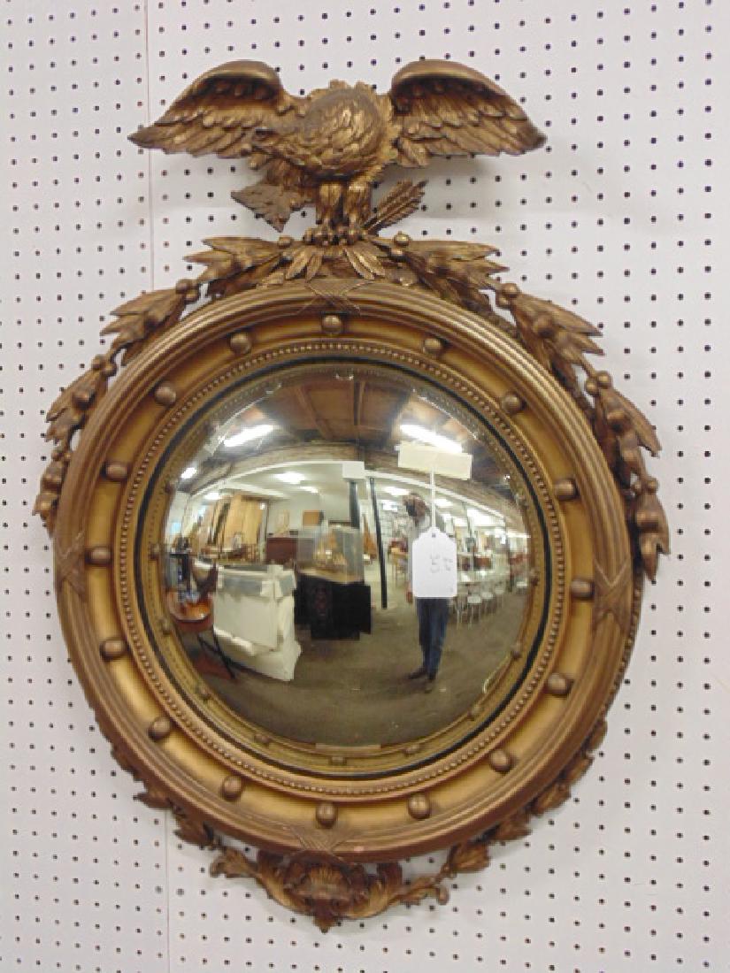 Gilt convex, bulls eye mirror with eagle, mirror is 35": Gilt convex, bulls eye mirror with eagle, mirror is 35" tall, glass is 17.5". please refer to images for additional general condition information, all items sold as found, all sales final, if possible