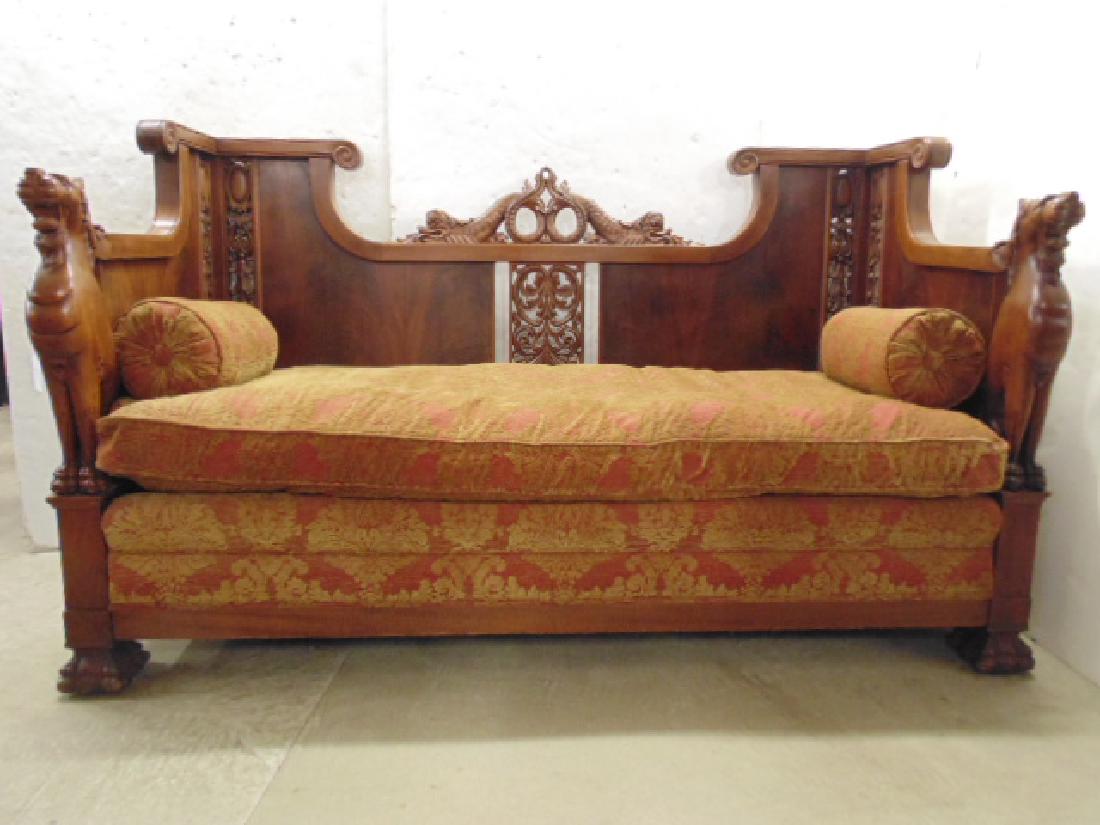 Heavily carved box sofa, in walnut with carved dragons: Heavily carved box sofa, in walnut with carved dragons & dolphins, claw feet, scrolled back, comes with custom upholstered seat & pillows, sofa is 71.25" long, 32" deep & 42.25" tall.