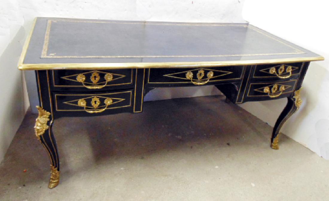 Bronze mounted French leather top desk, fine quality: Bronze mounted French leather top desk, fine quality black lacquered desk with bronze trim around top and applied to legs, hoof feet, desk has black leather top with gilt trim, 66.5" by 33", height is