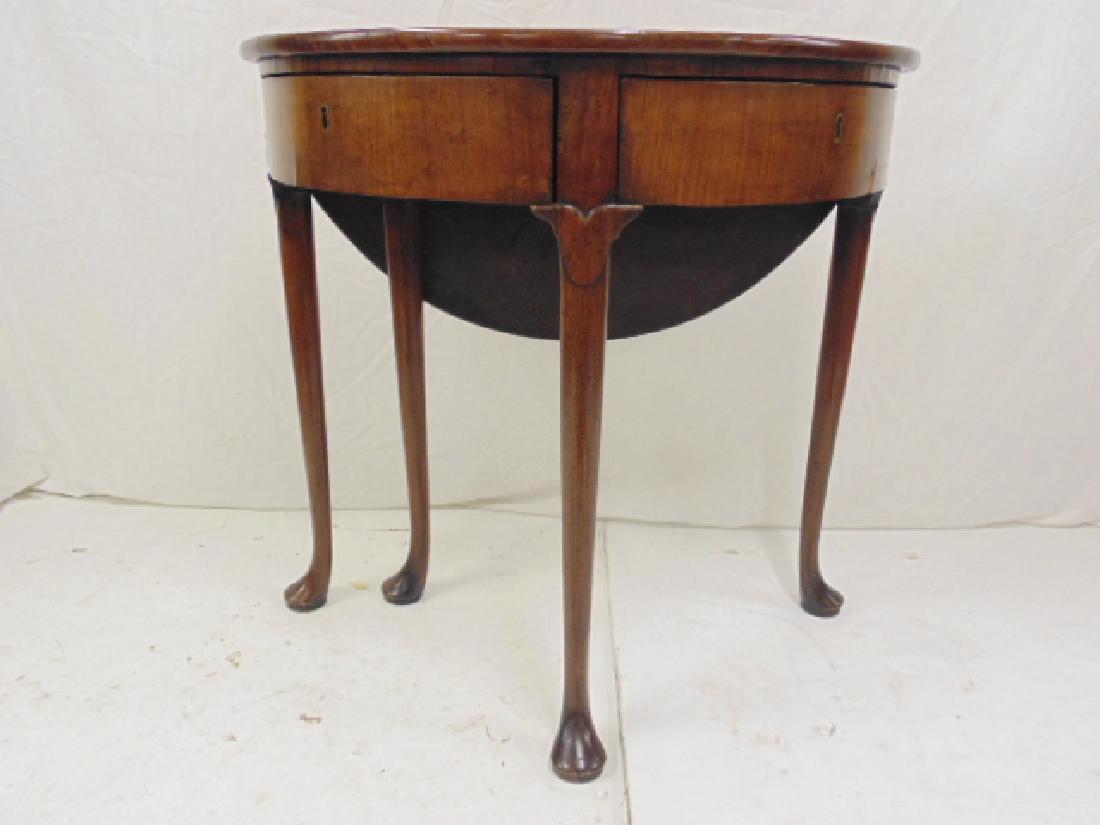 A rare Sabicu wood demi lune drop leaf game table,: A rare Sabicu wood demi lune drop leaf game table, circa 1720, with two swing our drawers, table is 30" by 15.25" (leaf down), height is 28.25"