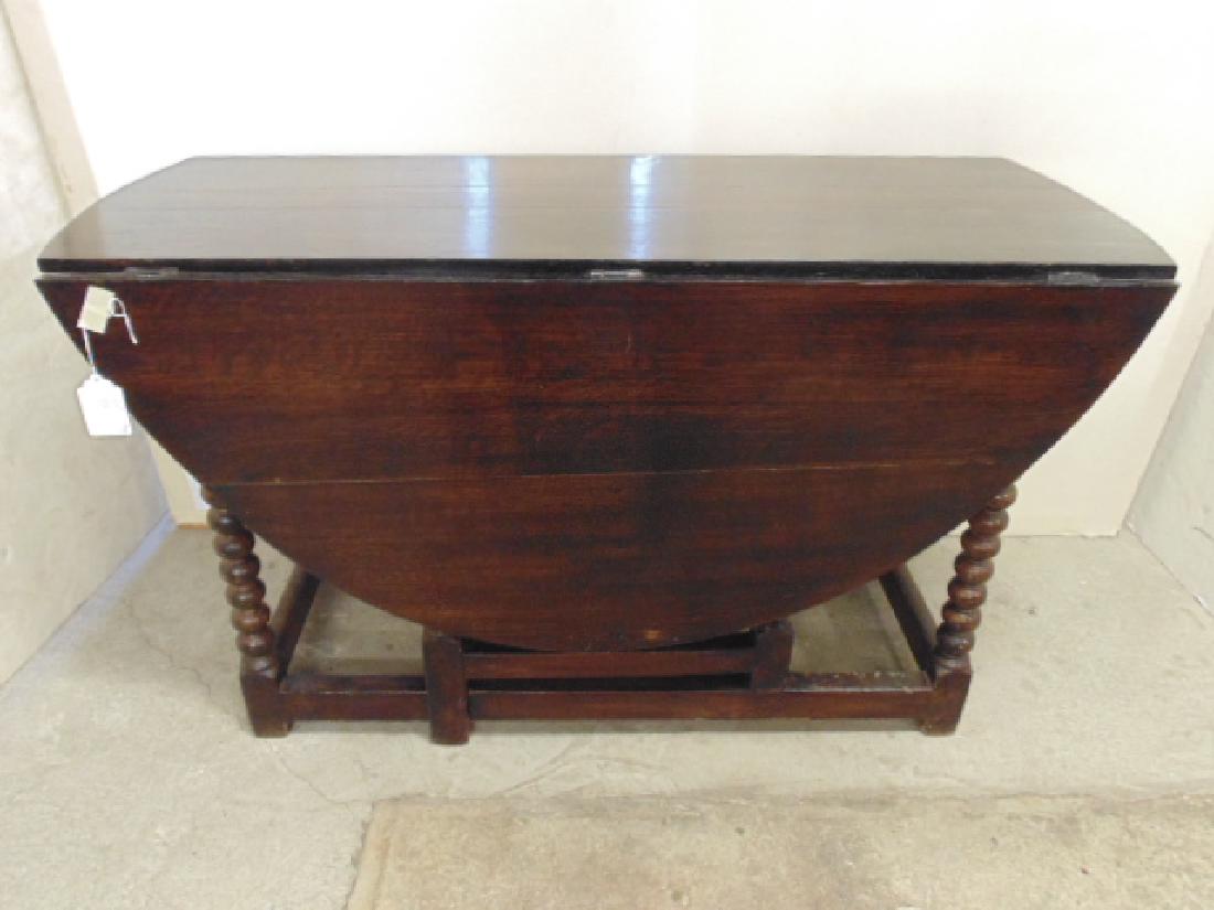 Oak spiral base drop leaf table, table has stretcher: Oak spiral base drop leaf table, table has stretcher base with swing out legs, gate leg, 48" wide 19" deep (closed), 54 1/2" open, 27 1/2" tall