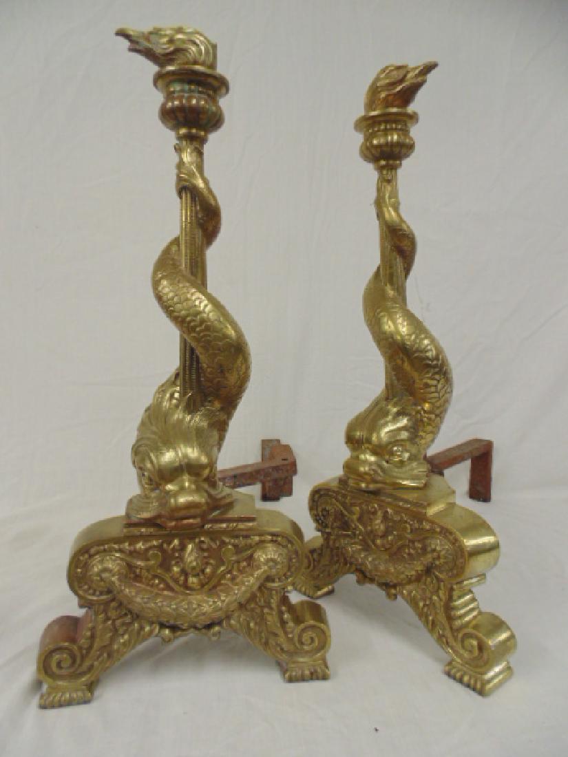 Pair bronze sea serpent andirons, showing a sea serpent: Pair bronze sea serpent andirons, showing a sea serpent wrapped around torch, polished patina, height is 24"