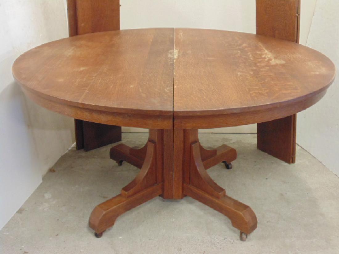 Round oak Gustav Stickley Craftsman dining table with 4