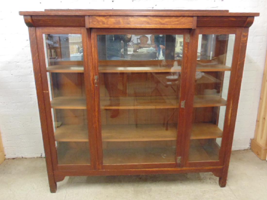 Stickley Brothers china cabinet, 3 glass panel front,: Stickley Brothers china cabinet, 3 glass panel front, single center door, original hardware, 65.5" by 18", height is 63", 3 wood shelves, original paper Quaint label, mirror on top section, small scra