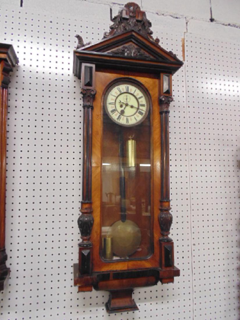 Vienna regulator wall clock, rosewood & mahogany, 2: Vienna regulator wall clock, rosewood & mahogany, 2 weights, one weight is loose, carved top, clock is 47" tall.