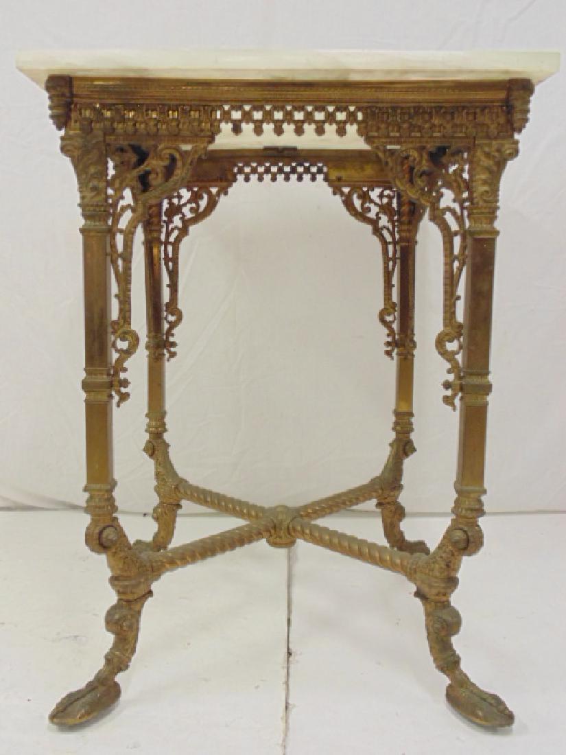 Onyx top, brass base table, ornate claw foot base with: Onyx top, brass base table, ornate claw foot base with decorative brass skirt, table is 24" by 24", height is 32.75"
