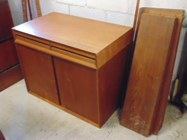 Teak wall unit, MCM design, includes one drawer unit,: Teak wall unit, MCM design, includes one drawer unit, one double drawer cabinet, 8 shelves & 3 rails, cabinet is 32" by 18", height is 20", there are 6 8.75" shelves & 2 11.75" shelves.Veneer damage t