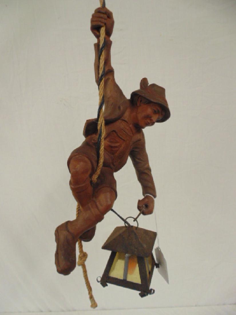 Carved Black Forest figural lantern, figure with hat (1 of 4)