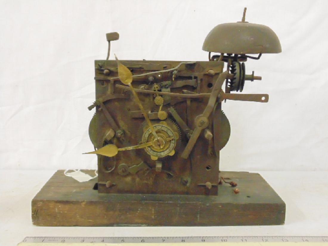 Antique clock works, appear 18th. Century, German,: Antique clock works, appear 18th. Century, German, Dutch ??, mounted on wood base, works are 7" by 7.75", sold as found