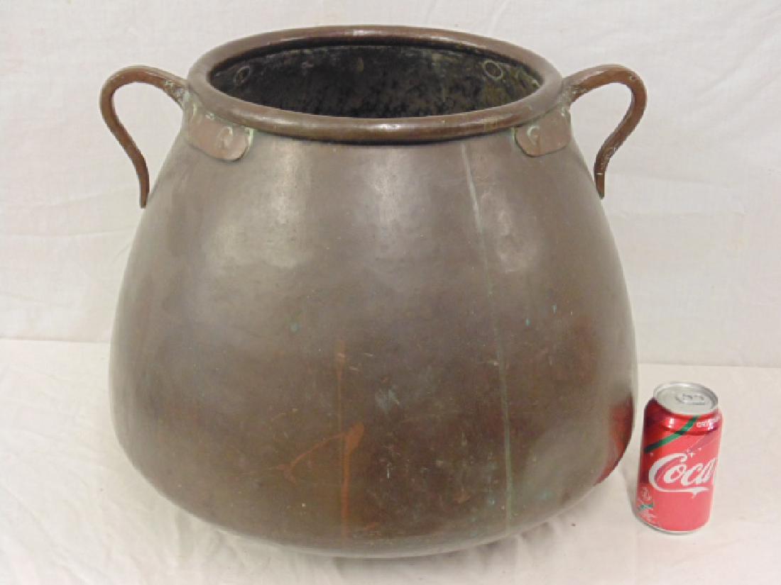 Large copper pot, handwrought with two handles, pot is (1 of 5)