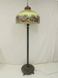 Tiffany style floorlamp with leaded shade, heavy bronze: Tiffany style floorlamp with leaded shade, heavy bronze base, 6 sockets, bronze caop, canopy, leaded shade decorated with band of leafs & flowers, height is 79", a facsimile, not original