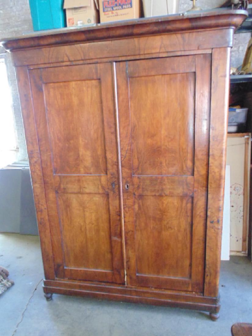 Burl wood armoire, Biedermeier style, double raised: Burl wood armoire, Biedermeier style, double raised panel doors, armoire is 56" by 21.5", height is 82.5", some damage to bottom door strip.