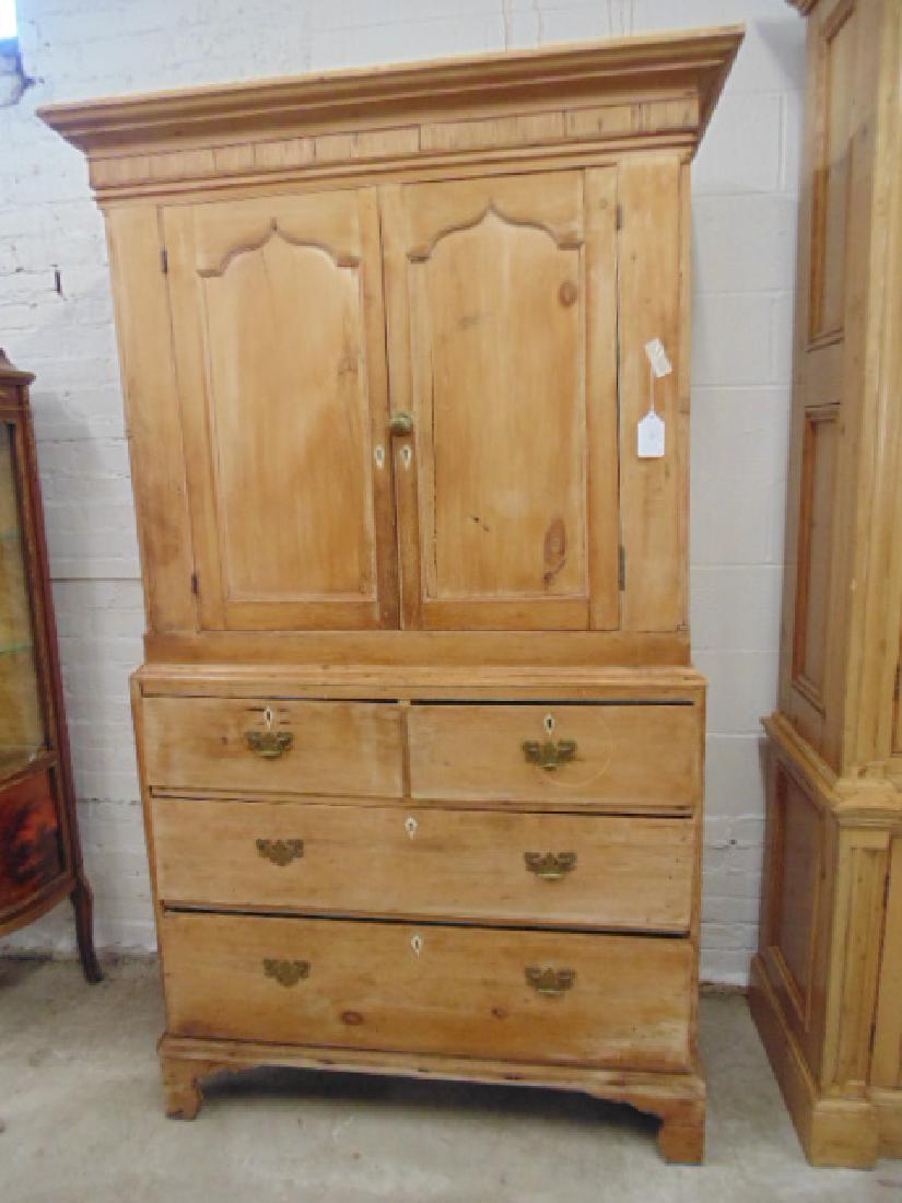 Pine linen press, New Jersey, 2 over 2 base, cabinet: Pine linen press, New Jersey, 2 over 2 base, cabinet door top, stripped, 2 piece unit, height is 77.5", 45.25" wide & 18.5" deep, base has piece of trim missing, some chips.