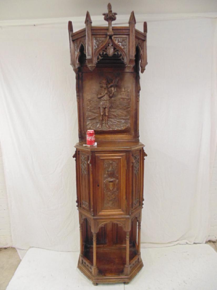 Gothic revival hall cabinet, carved figures, carved: Gothic revival hall cabinet, carved figures, carved back, coat of arms, armorial carvings, cabinet is 24" wide, 15" deep & 85.5" tall