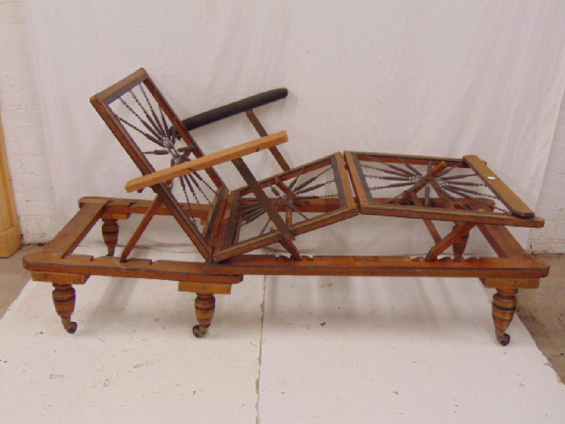 Alfred Carter, London Mechanical chaise recliner, a: Alfred Carter, London Mechanical chaise recliner, a fine mechanical chaise lounge with decorative starburst spring support, original "Alfred Carter 47 Holborn London" label, comes with 3 black cushion