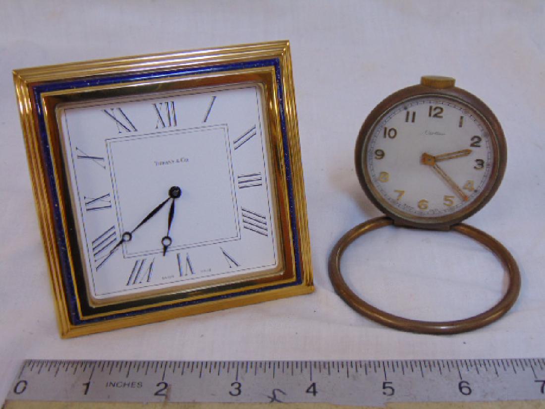 2 travel clocks, Tiffany & Cartier, Tiffany clock is 3: 2 travel clocks, Tiffany & Cartier, Tiffany clock is 3 7/8' by 3 7/8", Cartier is 3" in diameter.The Cartier does not wind, the Tiffany clock is quartz and the battery is dead, so both are "as is"