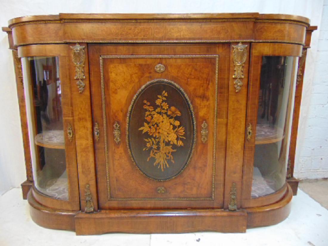 Inlaid Victorian credenza, curved glass sides, fine: Inlaid Victorian credenza, curved glass sides, fine inlaid center door, applied bronze decoration, cabinet is 70" by 18", height is 41.25"