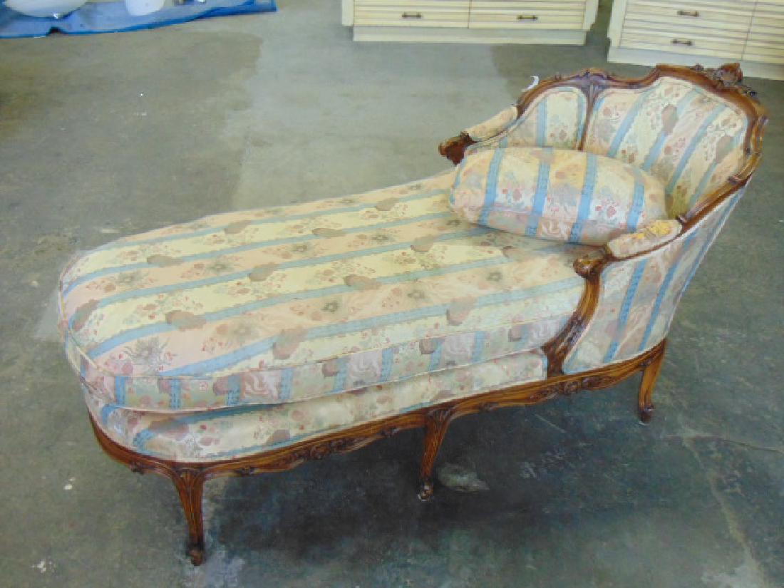 Upholstered chaise lounge, French chaise lounge with: Upholstered chaise lounge, French chaise lounge with upholstered sides & back, carved frame, 6 legs, upholstery on arms is deteriorated, 61" long , 28.5" wide & 35" tall