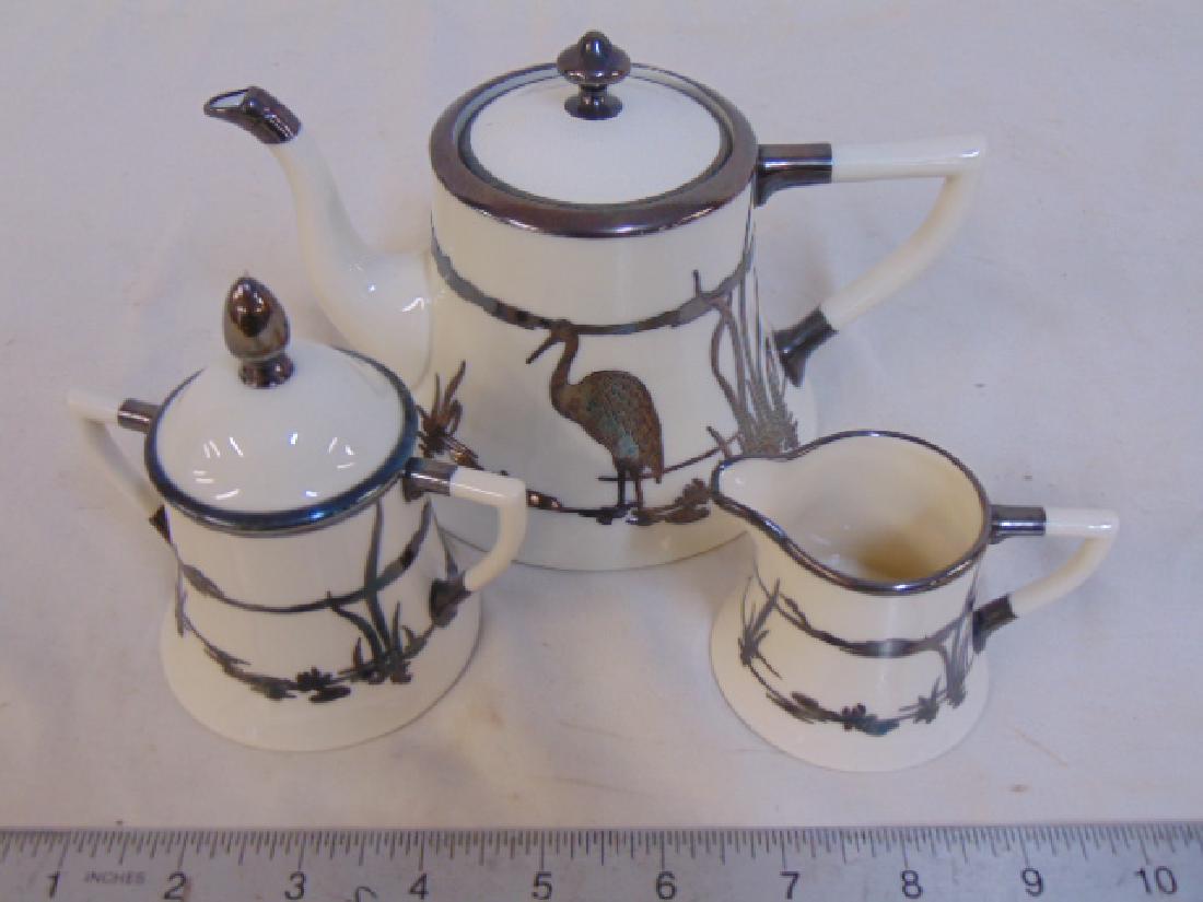 Lenox silver overlay tea set, 3 piece set, ivory: Lenox silver overlay tea set, 3 piece set, ivory colored silver overlay, sugar, creamer & small tea pot, decorated with stork, good condition