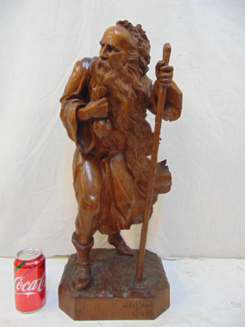 Woodcarving, St. Nicholas, Gd. Robinson, Sculpt. carved: Woodcarving, St. Nicholas, Gd. Robinson, Sculpt. carved wood sculpture of Saint Nicholas holding staff & money bad, height is 23.75", signed.