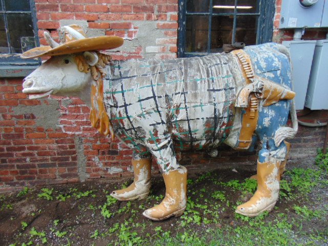 3 fiberglass cows, lifesize, Cowlamity Jane: 3 fiberglass cows, 2 life size cows, including "Cowlamity Jane, & small cow , all in bad condition, need restoration"