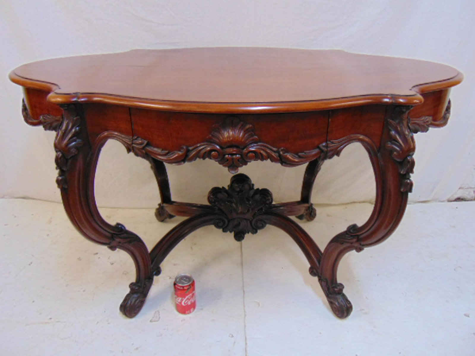 Turtle top carved base table, carved mahogany turtle: Turtle top carved base table, carved mahogany turtle top center table with single drawer, French polished, table is 51.5" by 34.5", height is 28"