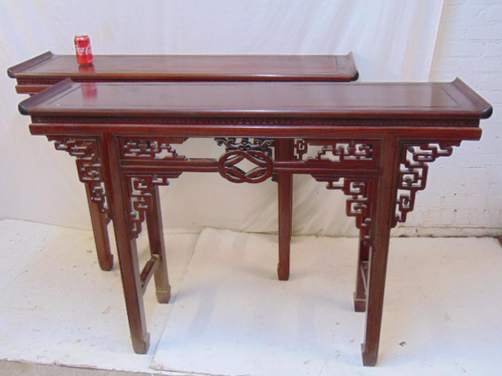 Pair Chinese rosewood console tables, two matching: Pair Chinese rosewood console tables, two matching console or sofa tables in rosewood finish worn, each table is 56" long, 14.75" deep & 38.5" tall.