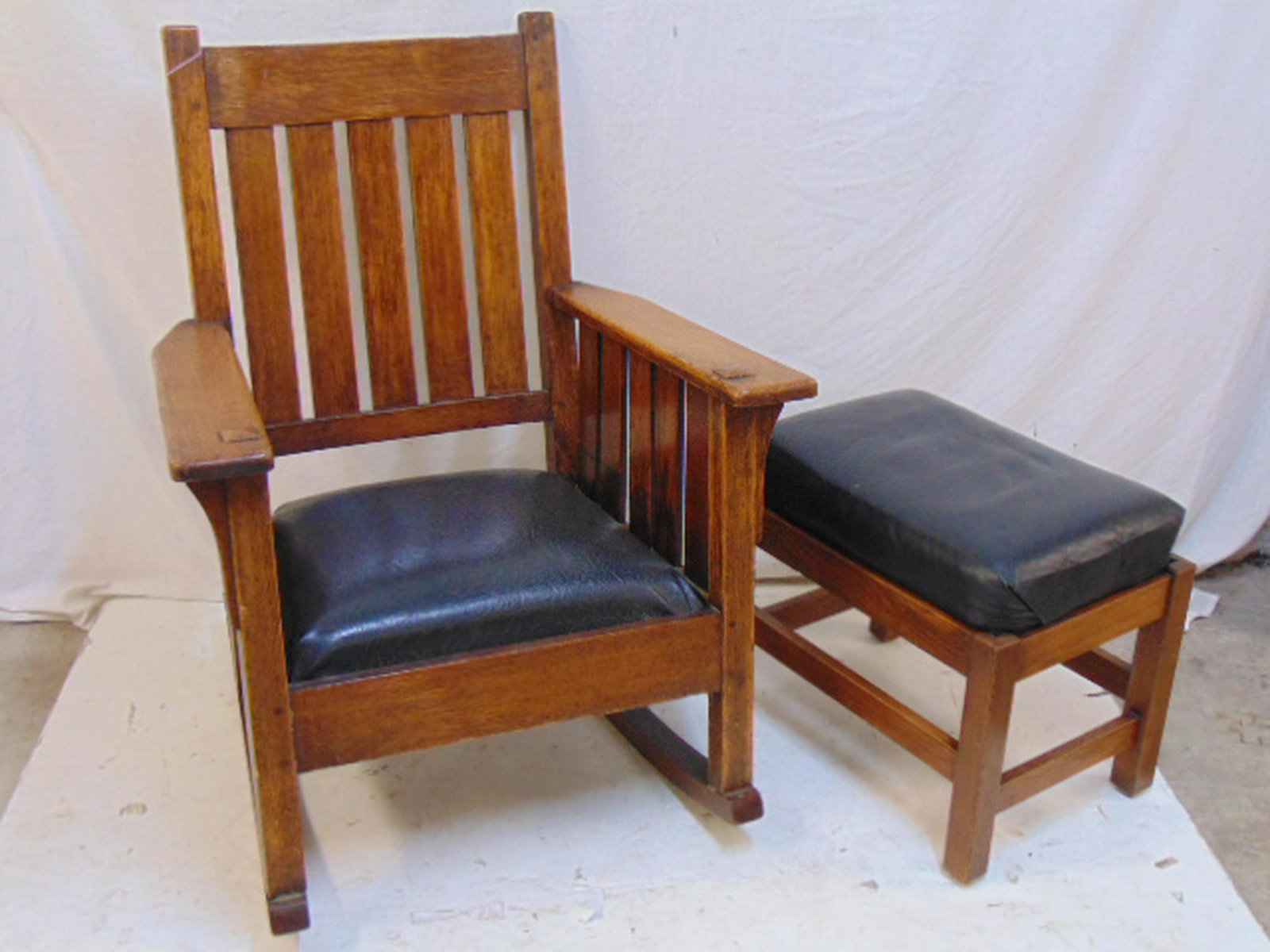 Mission oak rocker & footstool, arts & crafts armchair: Mission oak rocker & footstool, arts & crafts armchair rocker & small footstool, stool is 20" by 13.75", height is 17", rocker is 27.5" wide, 22.25" deep & 36.5" tall, seat height is 15"