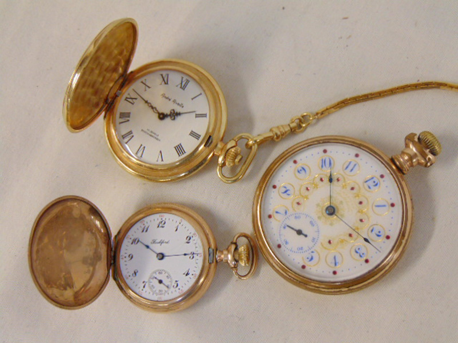 3 pocket watches, Rockford, Waltham & Andre Rivalle,: 3 pocket watches, Rockford, Waltham & Andre Rivalle, only the Rockford watch works, Rockford watch 1908, serial number 761738, Waltham has decorated porcelain dial.