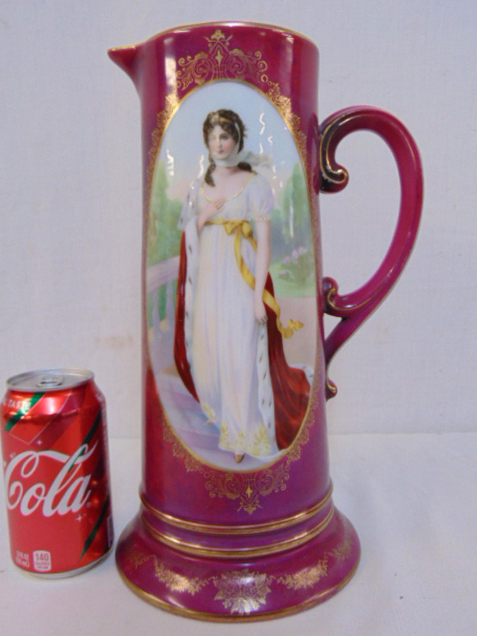 Austrian porcelain pitcher with portrait, large pitcher: Austrian porcelain pitcher with portrait, large pitcher with portrait of lady in mink coat, gilt highlights, pitcher is 12.5" tall, small chip on spout, see images