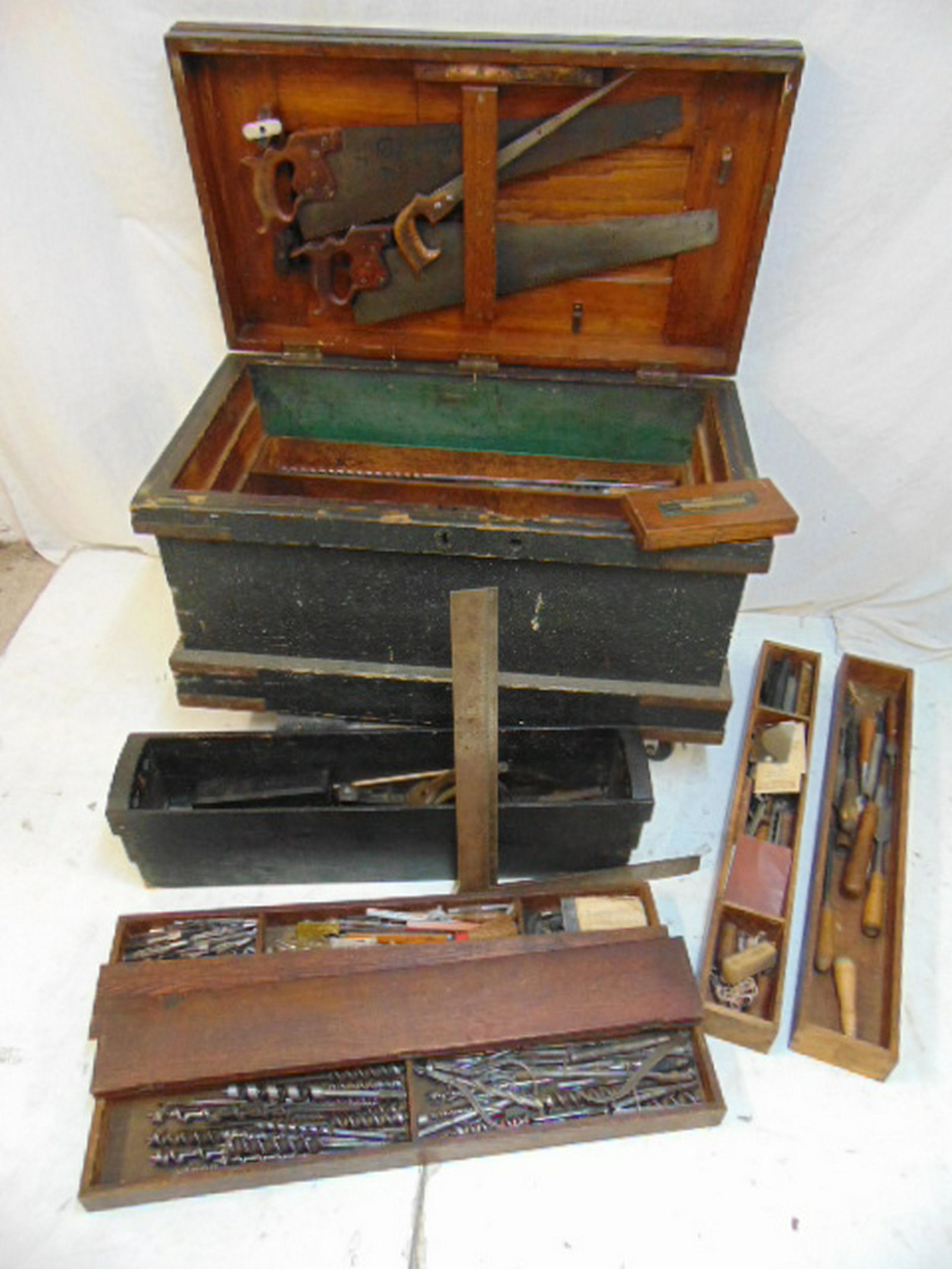 Carpenters tool chest filled with tools, chest has: Carpenters tool chest filled with tools, chest has several pull out trays all filled with tools including drills, saws, planes, chisels, precision instruments and more, actual chest is 37.5" by 20.25"