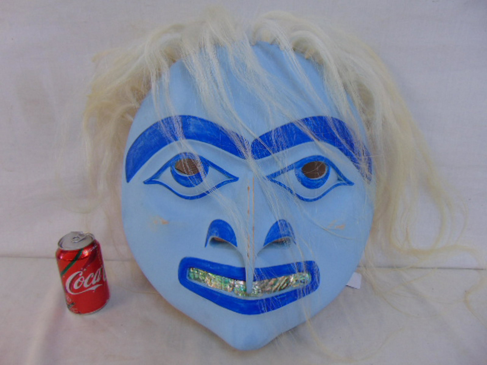 Pacific North West ceremonial mask, painted & carved: Pacific North West ceremonial mask, painted & carved wood, abalone shell teeth & hair, mask is 17" tall, 16" wide, signed illegibly.