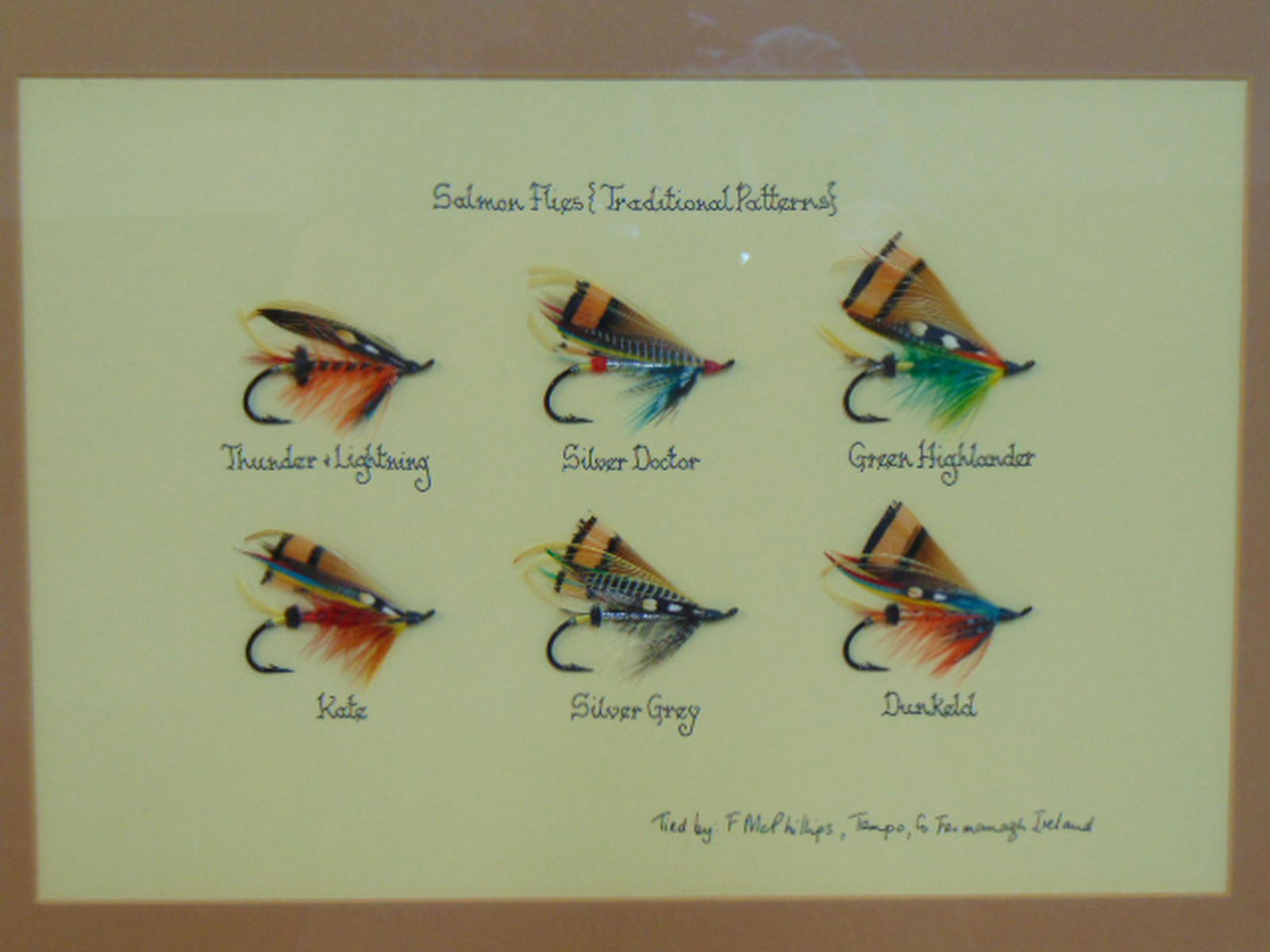 Framed collage with fishing flies, 6 hand made Salmon: Framed collage with fishing flies, 6 hand made Salmon Flies in traditional patterns, tied by F. McPhilips, Fermanagh, Ireland.