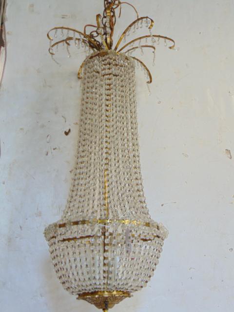 Crystal hanging fixture, strands of crystal, domed: Crystal hanging fixture, strands of crystal, domed base, chandelier is 35" tall, 12" wide.