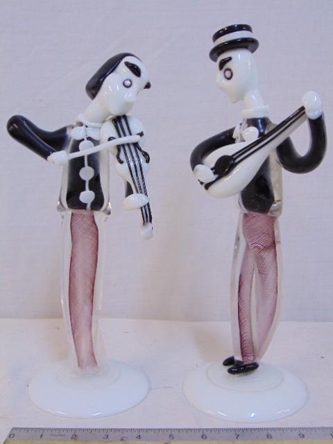 Pair Murano art glass musician figures, manner of: Pair Murano art glass musician figures, manner of Archimede Seguso, two Italian art glass figurines, violin & mandolin player, height is 12" & 12.75", Mandolin tip missing.