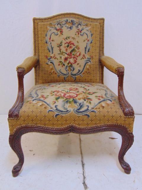 Needlepoint armchair, fine carved frame with serpent: Needlepoint armchair, fine carved frame with serpent style arms, floral upholstery, chair is 24" by 21" (seat), height is 36.5"