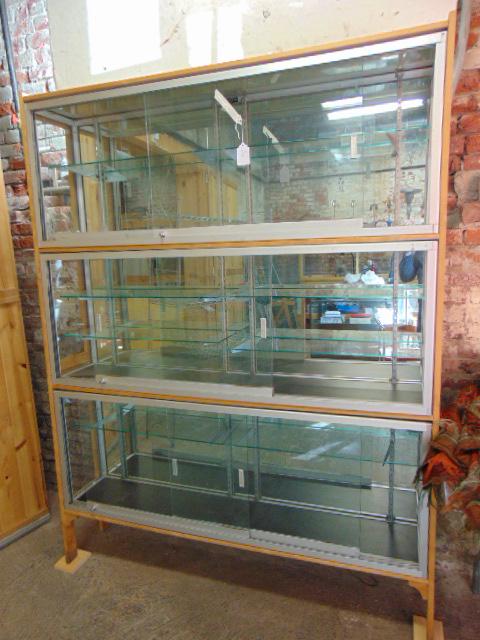 Large sectional showcase, 3 sliding door cabinets: Large sectional showcase, 3 sliding door cabinets fitted in wood case, 80.5" by 62", by Gorbaty Bros. Inc., New York City.