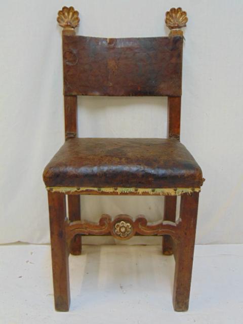 French walnut chair with leather seat & back, carved: French walnut chair with leather seat & back, carved gilt seashell finials, early 18th Century, chair is 19" by 16.5" (seat), height is 40.5"