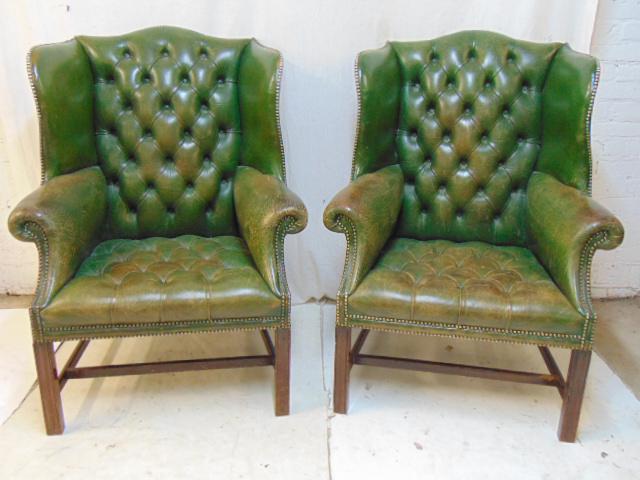 Pair green leather tufted wing chairs, wingback wing: Pair green leather tufted wing chairs, wingback wing chairs, leather is distressed, worn, but no rips or holes, each chair is 34" by 25", height is 45"